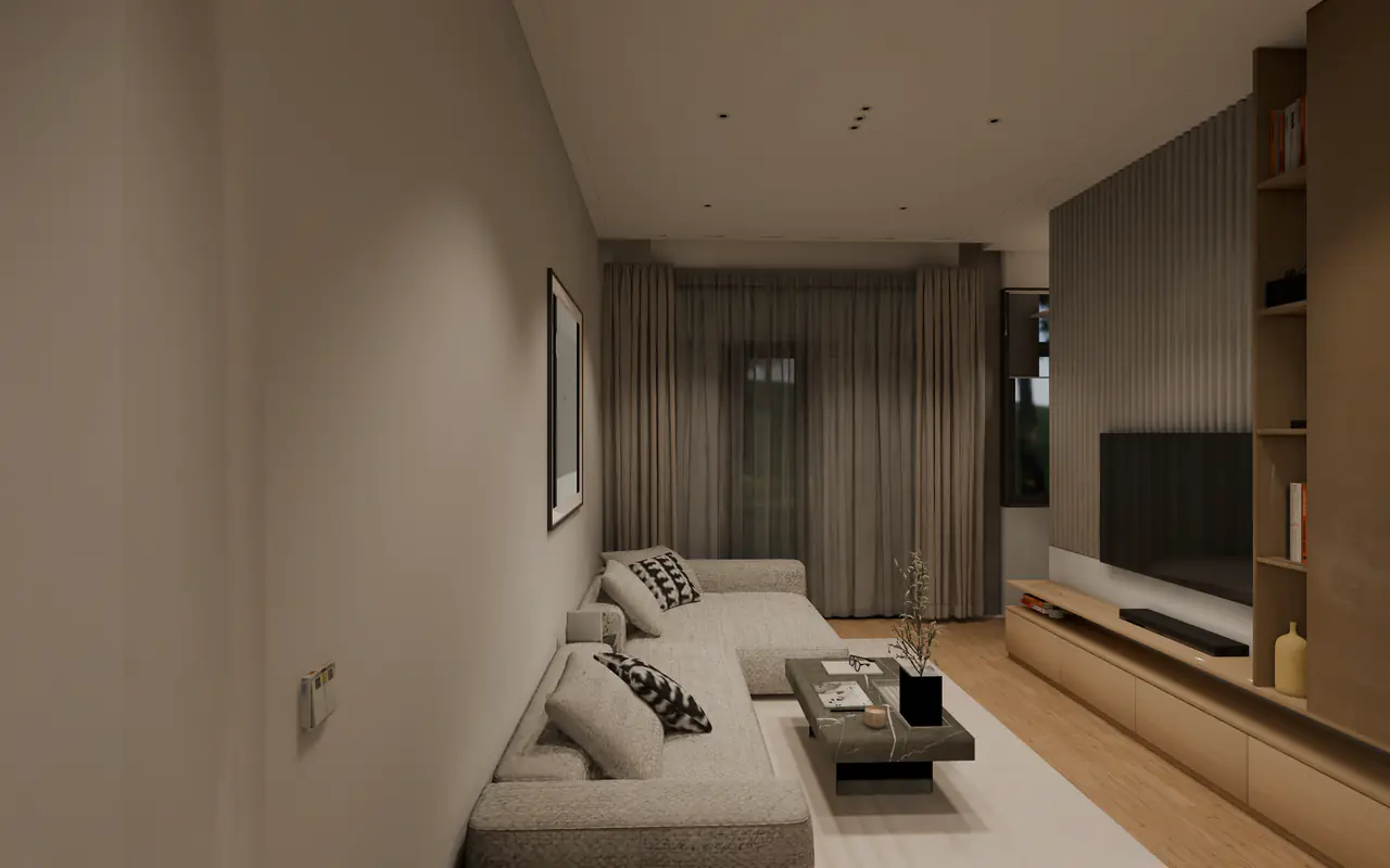 The lounge of an open-plan flat: a grey sectional sofa and a stone coffee table on a white rug, a TV wall with wood shelving and slatted panels, and full-length curtains.