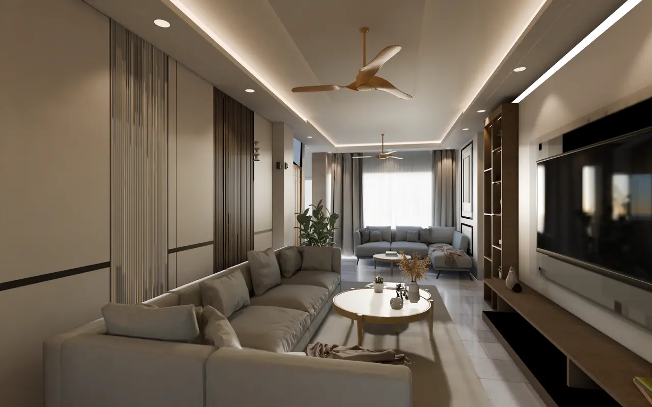 A long living room with a cove-lit ceiling and wooden ceiling fans, an L-shaped grey sofa around round coffee tables, slatted wall panels and a TV wall framed in wood shelving.